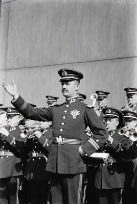 Military officer saluting with band