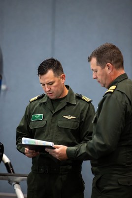Two military officers reviewing map