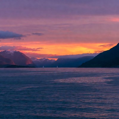 Sailboats in Fjord at Sunset