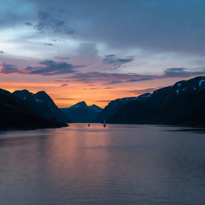 Sailboats in Fjord at Sunset