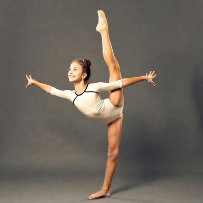 Young girl doing gymnastic split