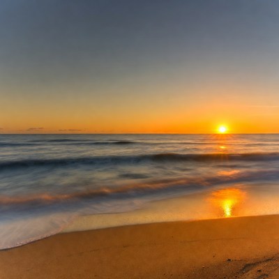 Sunset over ocean waves