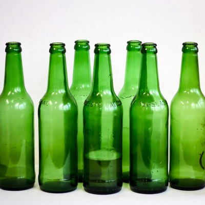 Green Glass Bottles on White Background