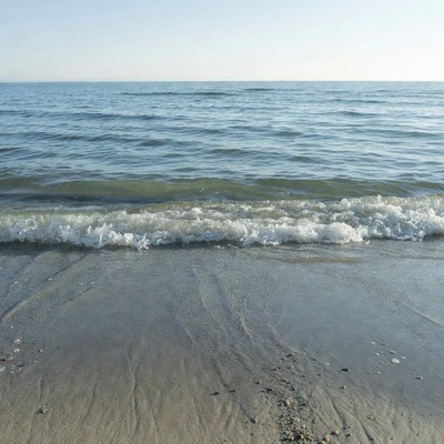 Ocean Waves Crashing on Sandy Beach