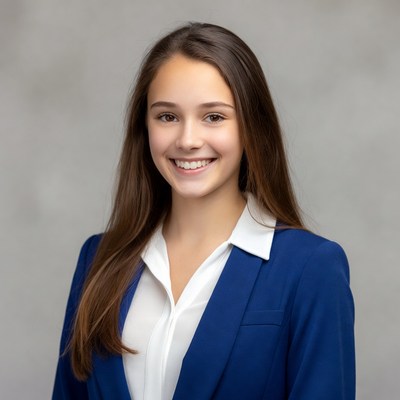 Smiling young woman in blue blazer
