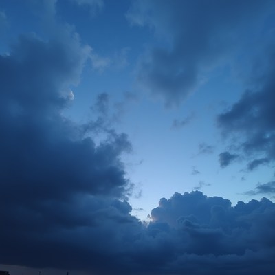 Moon in Blue Cloudy Sky