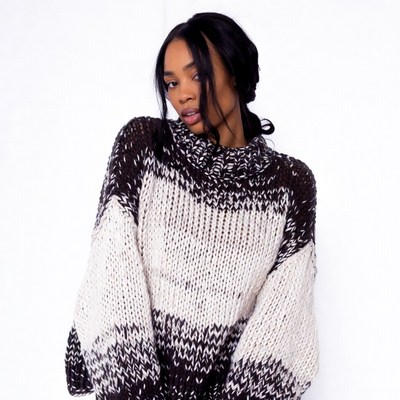 African-American woman in chunky knit sweater