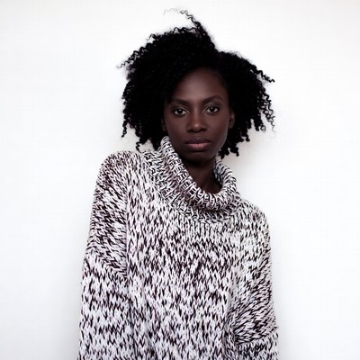 African-American woman in turtleneck sweater