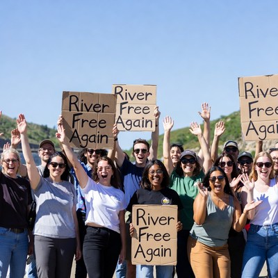 Group holding River Free Again signs