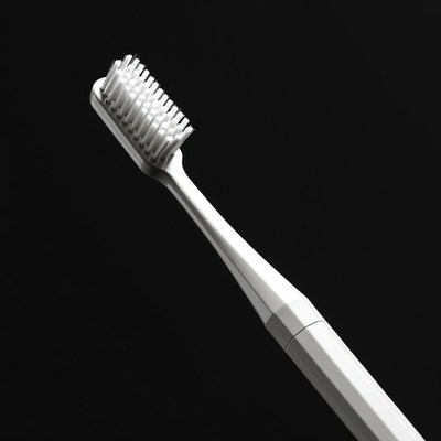 White Toothbrush on Black Background