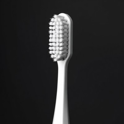 White toothbrush isolated on black