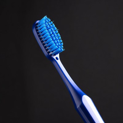 Blue toothbrush on black background