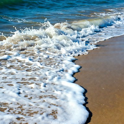 Ocean Waves Crashing on Sandy Beach