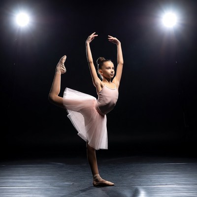 Young girl doing ballet arabesque pose