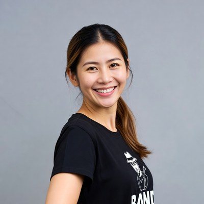 Asian woman smiling in band t-shirt
