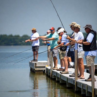 Group of men fishing on dock