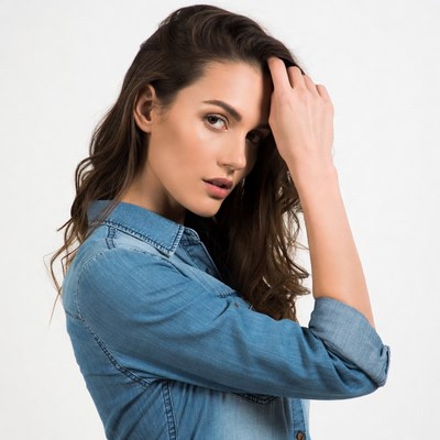 Woman touching hair in profile