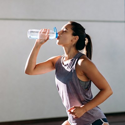 Woman drinking water from bottle