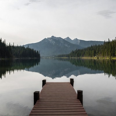Wooden Dock Over Calm Mountain Lake