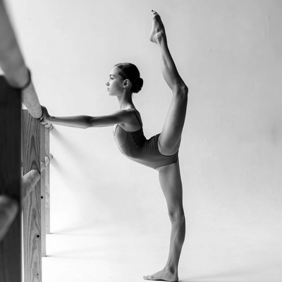 Girl doing ballet splits on barre