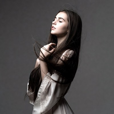 Woman in lace dress with flowing hair