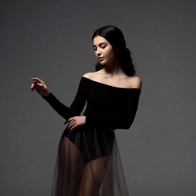 Woman in black off-shoulder tulle dress