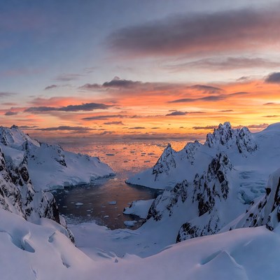 Antarctic Fjord Sunset with Icebergs