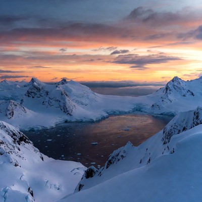Antarctic Mountains with Frozen Lake Sunset