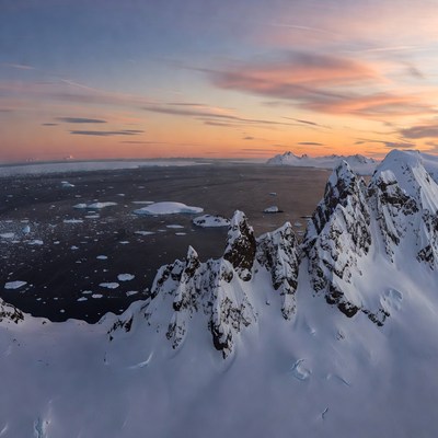 Antarctic Mountains and Iceberg Sunset