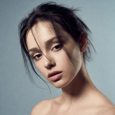 Young woman with messy black hair