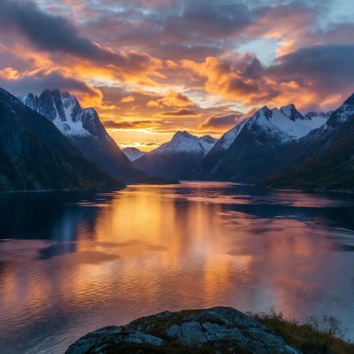 Sunset over Snowy Mountains and Lake