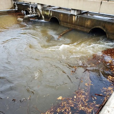 Water flowing under concrete bridge