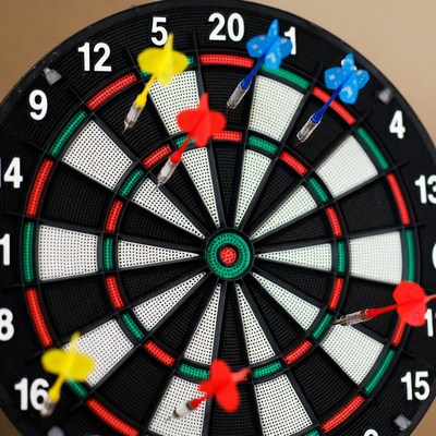 Dartboard with colorful darts