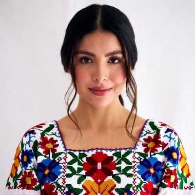 Woman in embroidered Mexican blouse
