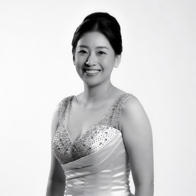 Asian woman in beaded gown smiling