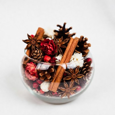 Cinnamon Sticks and Pine Cones in Glass Bowl