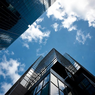Modern Glass Skyscrapers Against Blue Sky