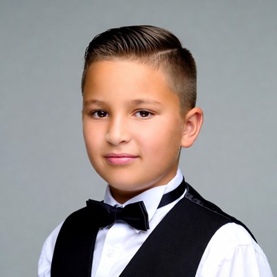 Boy in black vest and bow tie