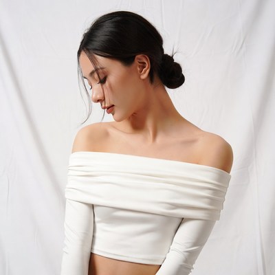 Asian woman in off-shoulder white top