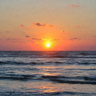 Sunset over ocean waves