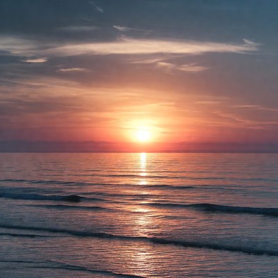 Sunset over ocean waves