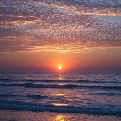 Sunset over ocean waves