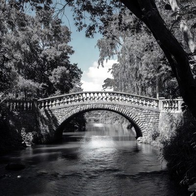 Stone arched bridge over river