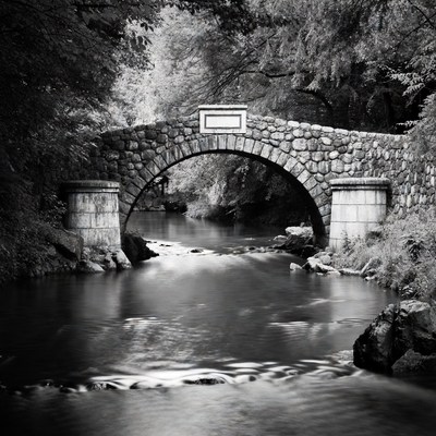 Stone Arch Bridge over Forest Stream