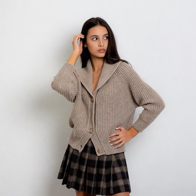 Woman in beige cardigan and plaid skirt