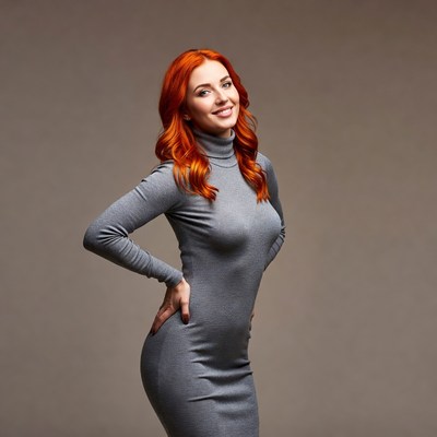 Redhead woman in gray turtleneck dress