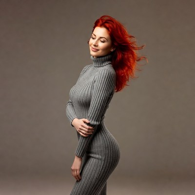 Redhead woman in gray turtleneck dress