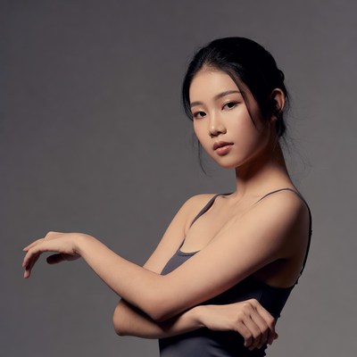 Asian woman posing with crossed arms