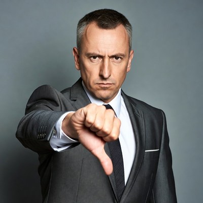 Man pointing thumbs down