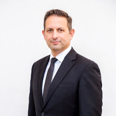 Man in black suit on white background